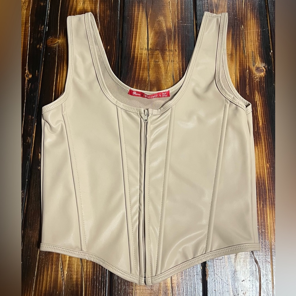 Tan corset tank top with zipper.